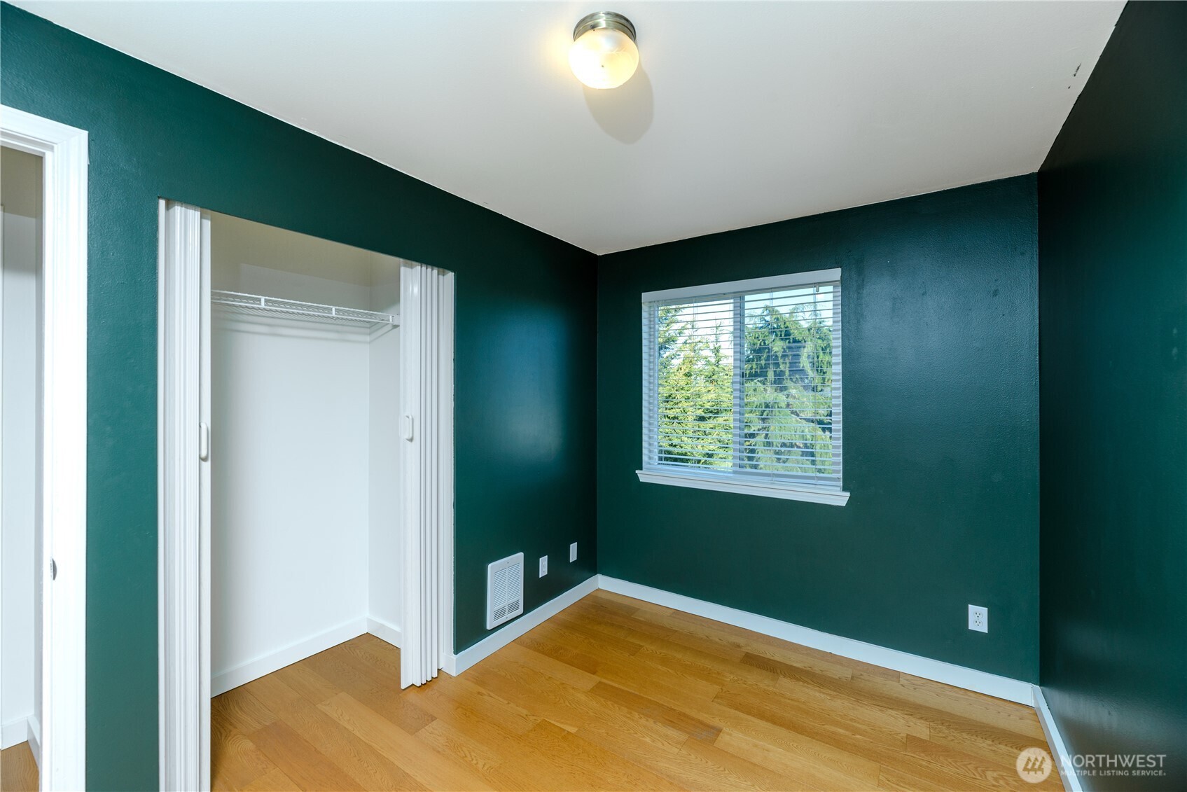 131 Alpine Loop Sequim, WA 98382 - Photo 33 of 40 a view of a bedroom with a bed and a window