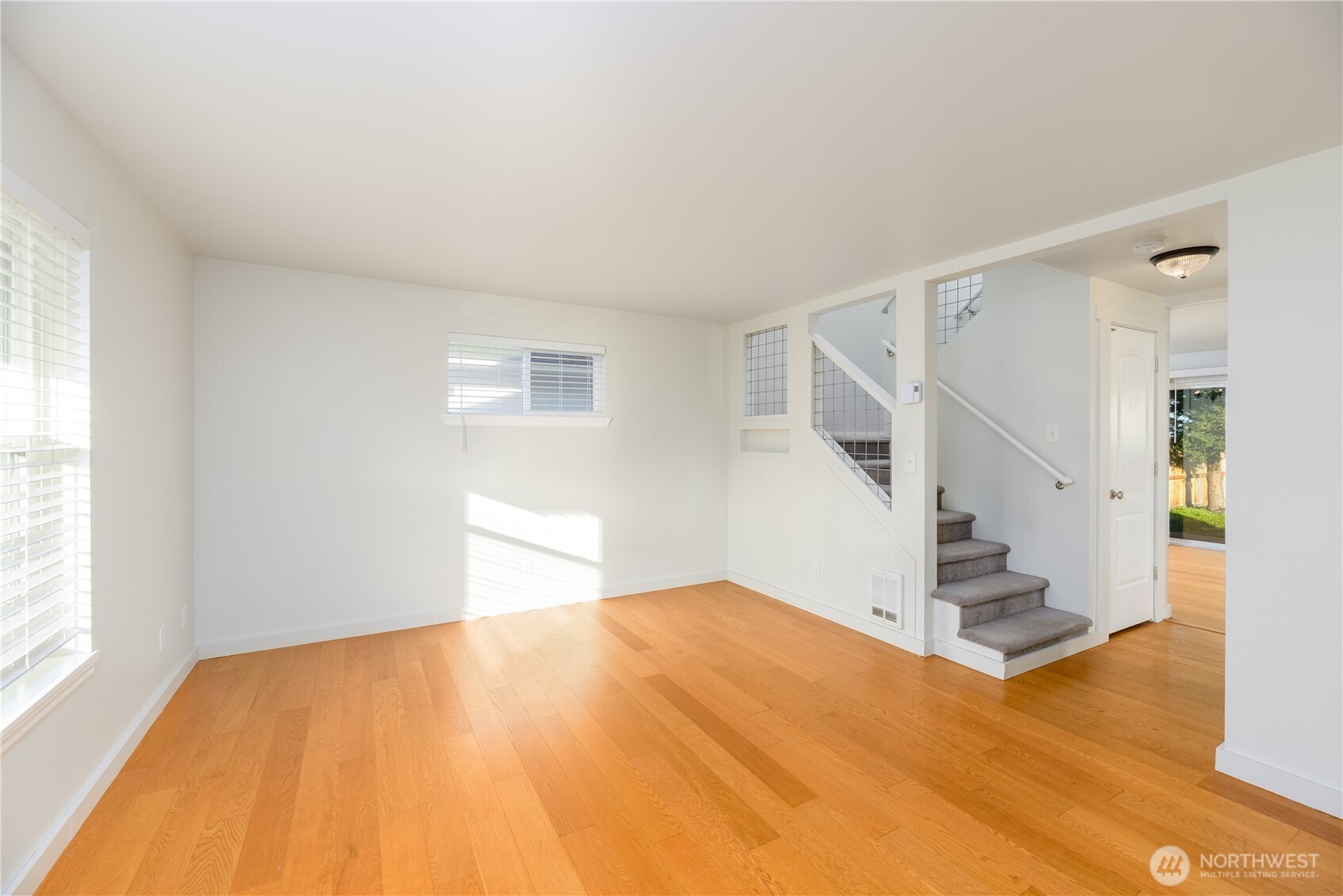 131 Alpine Loop Sequim, WA 98382 - Photo 10 of 40 a view of empty room with wooden floor and stairs