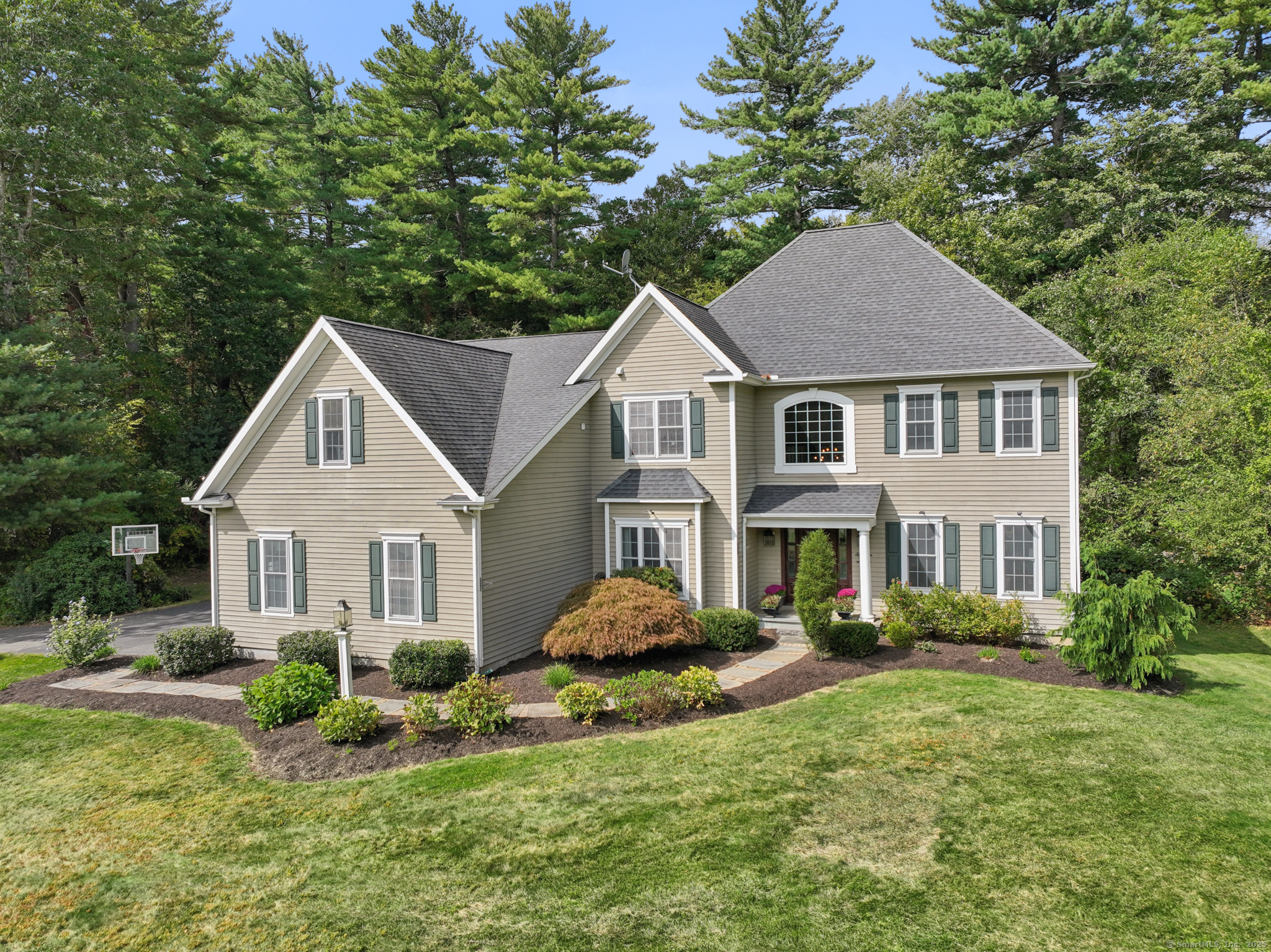 247 Old Farms Road Simsbury, CT 06070 - Photo 1 of 1 a front view of a house with a yard and potted plants