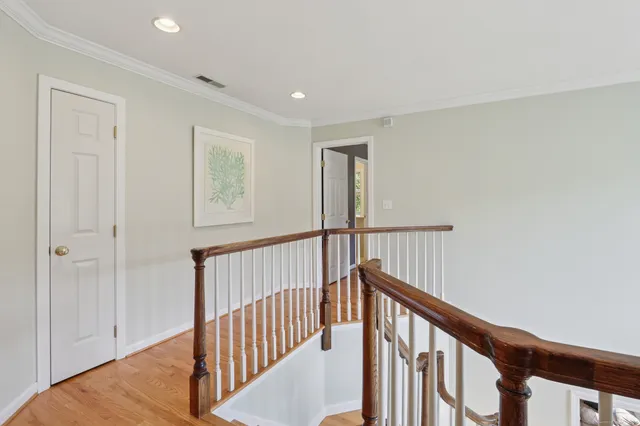 a view of an entryway with wooden floor