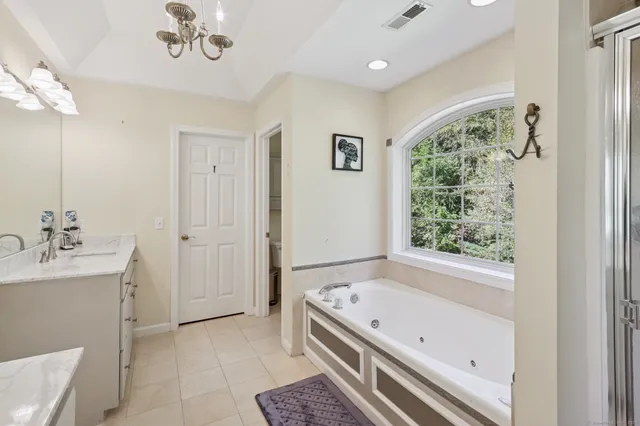 a bathroom with a bathtub and a sink