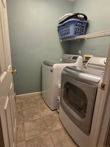 a utility room with dryer and washer