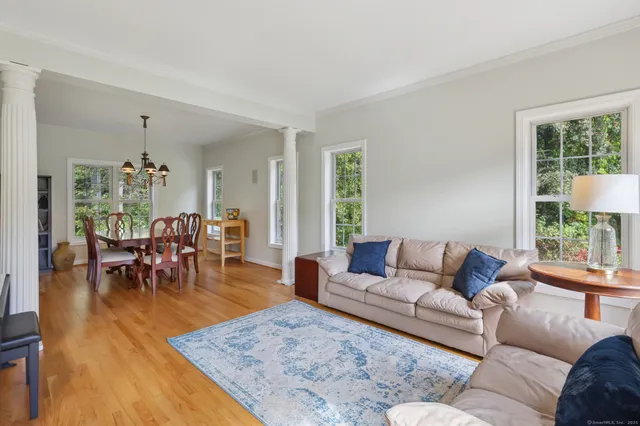 a living room with furniture and a table