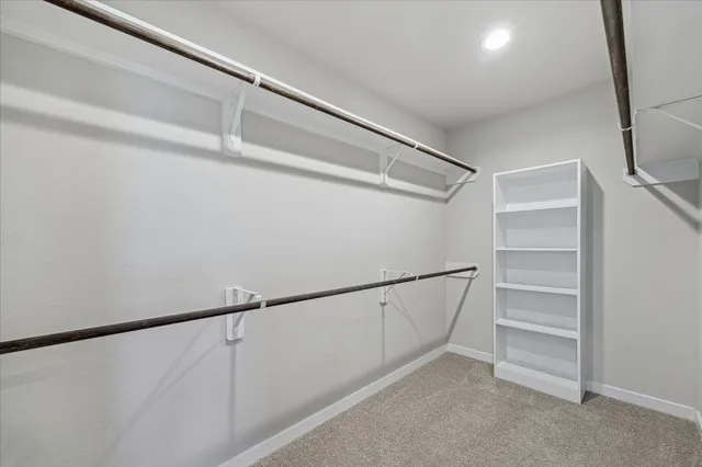 a view of an empty walk in closet