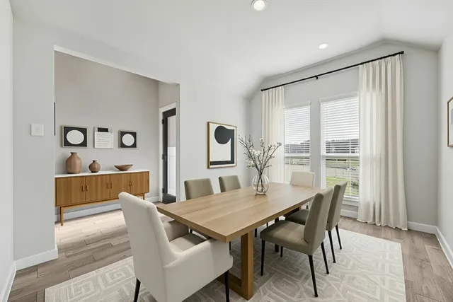 a view of a dining room with furniture