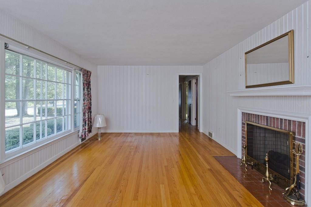 48 Collingwood Road Springfield, MA 01119 - Photo 3 of 27 a view of empty room with wooden floor and fireplace
