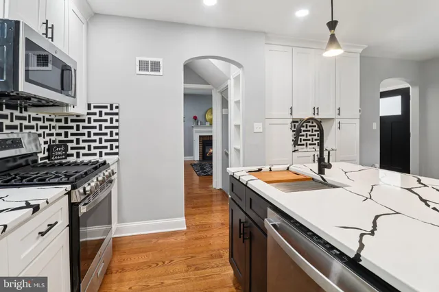a kitchen with a stove and a sink