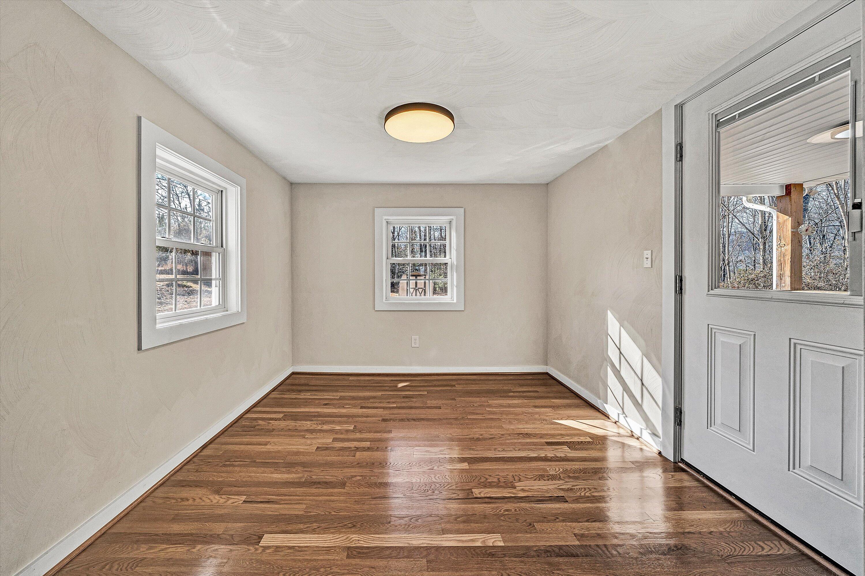 4883 Edwardsville Road Hardy, VA 24101 - Photo 11 of 32 a view of a livingroom with wooden floor and a window