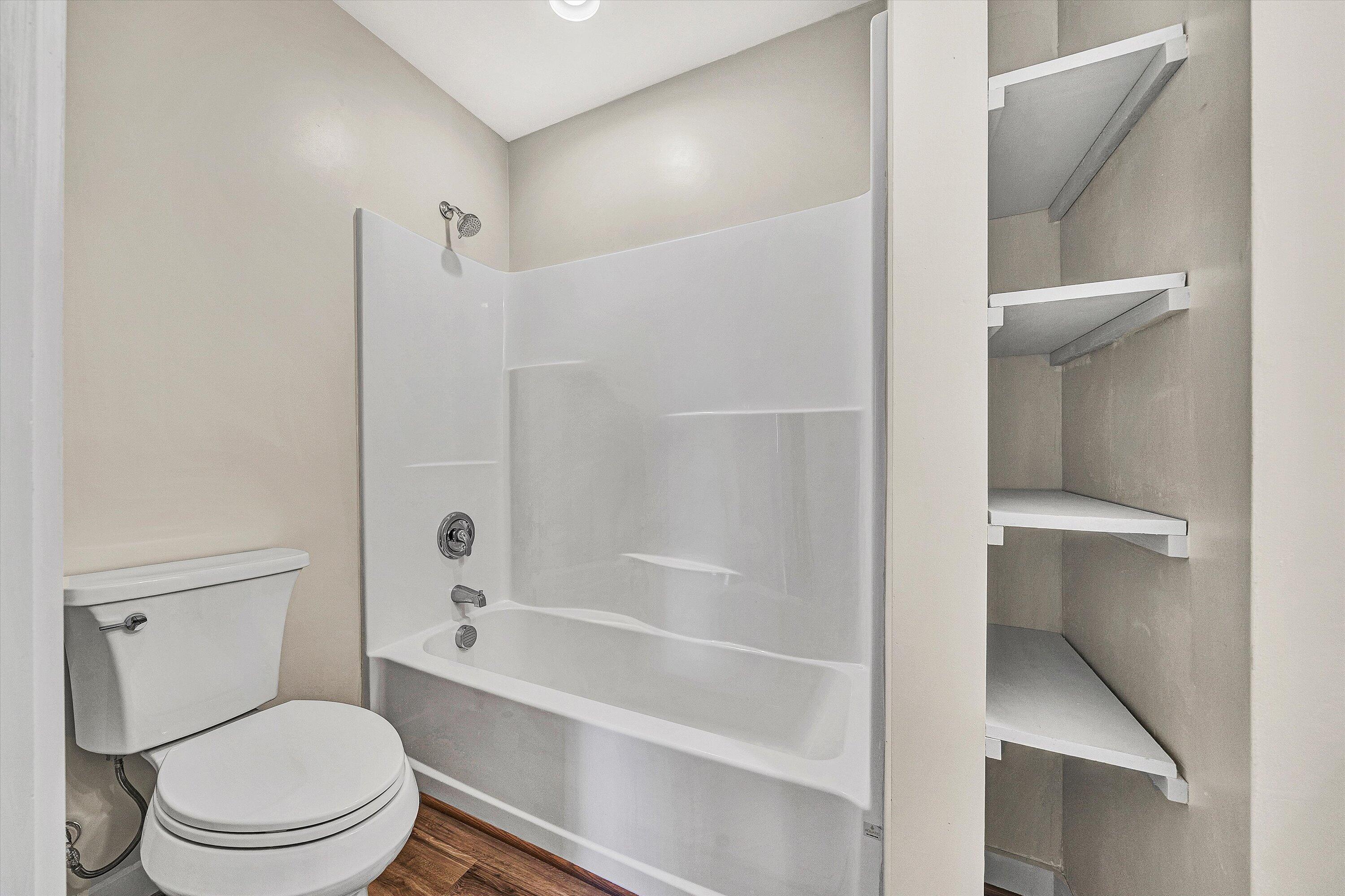 4883 Edwardsville Road Hardy, VA 24101 - Photo 14 of 32 a bathroom with a toilet and a bath tub