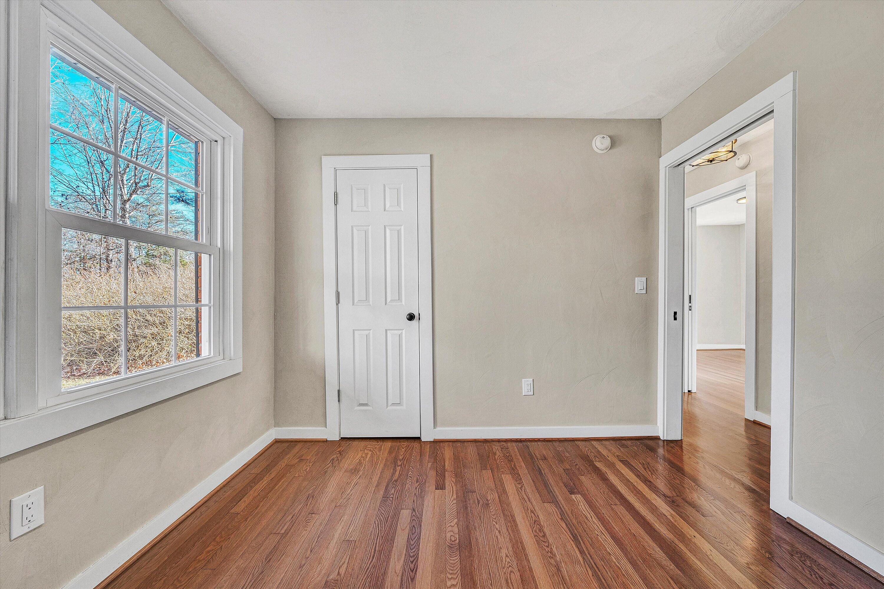 4883 Edwardsville Road Hardy, VA 24101 - Photo 17 of 32 an empty room with wooden floor and windows