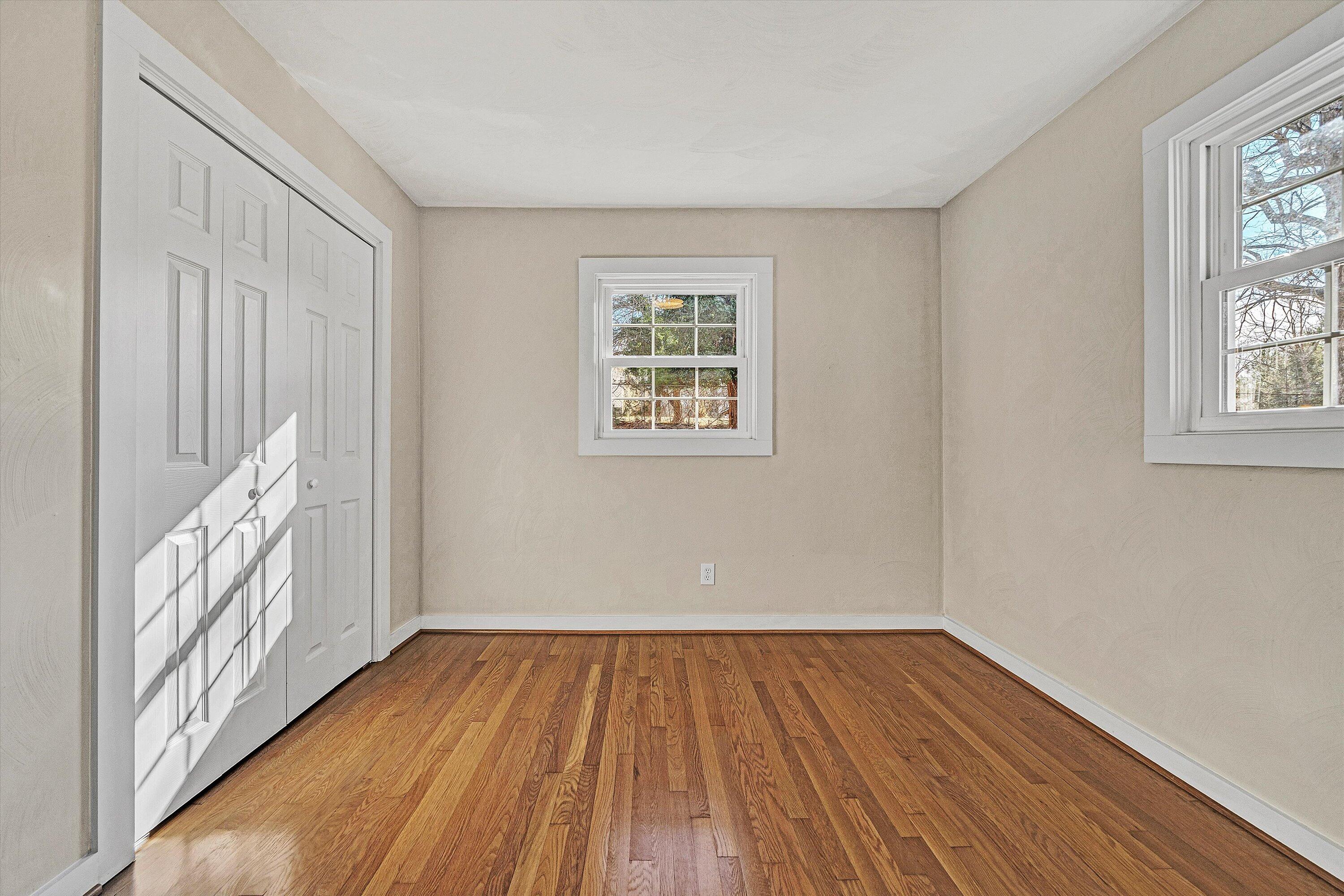 4883 Edwardsville Road Hardy, VA 24101 - Photo 19 of 32 a view of an empty room with wooden floor and a window