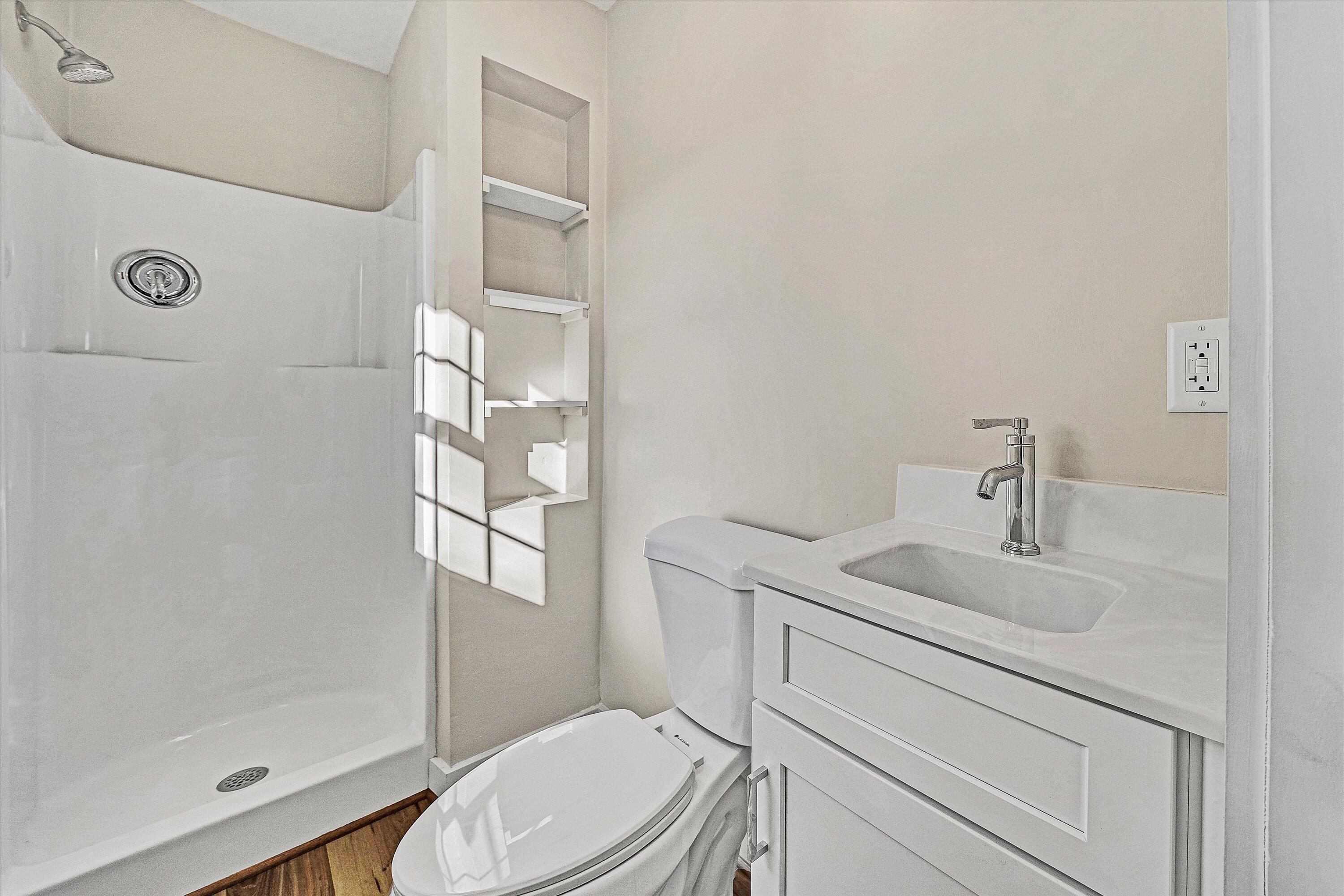 4883 Edwardsville Road Hardy, VA 24101 - Photo 21 of 32 a bathroom with a sink a toilet and shower