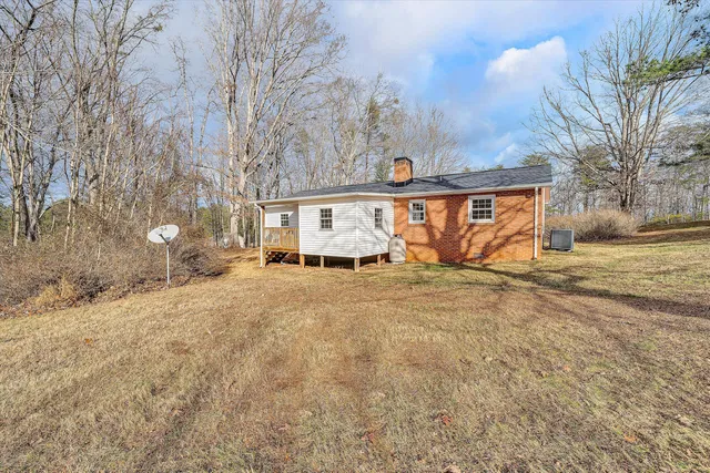 a view of a house with a yard and garage