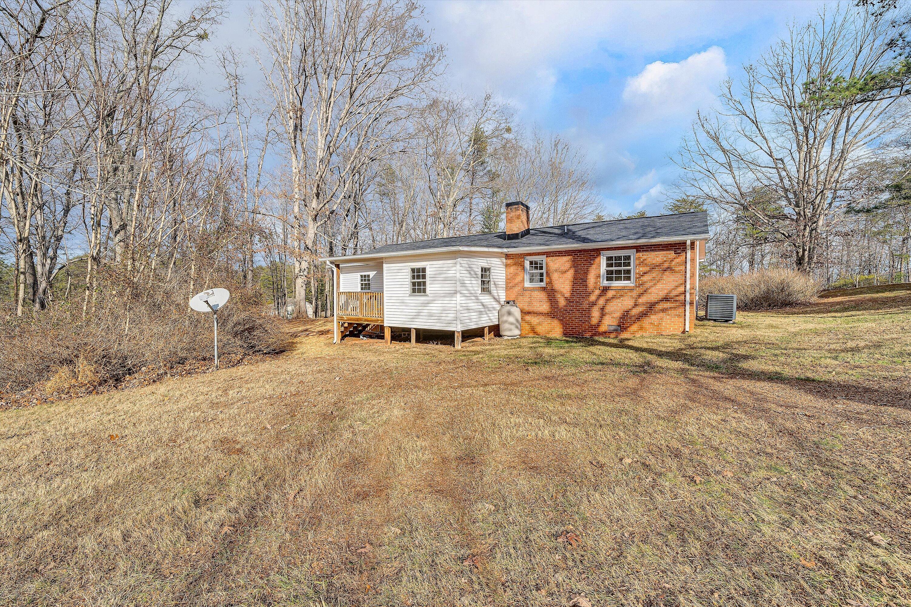 4883 Edwardsville Road Hardy, VA 24101 - Photo 31 of 32 a view of a house with a yard and garage