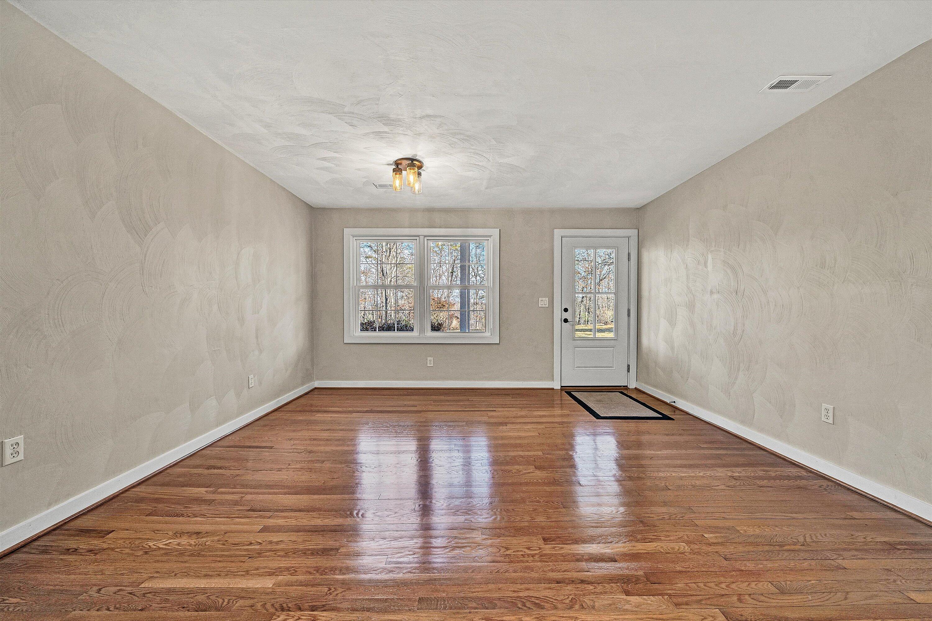 4883 Edwardsville Road Hardy, VA 24101 - Photo 5 of 32 wooden floor in an empty room with a window