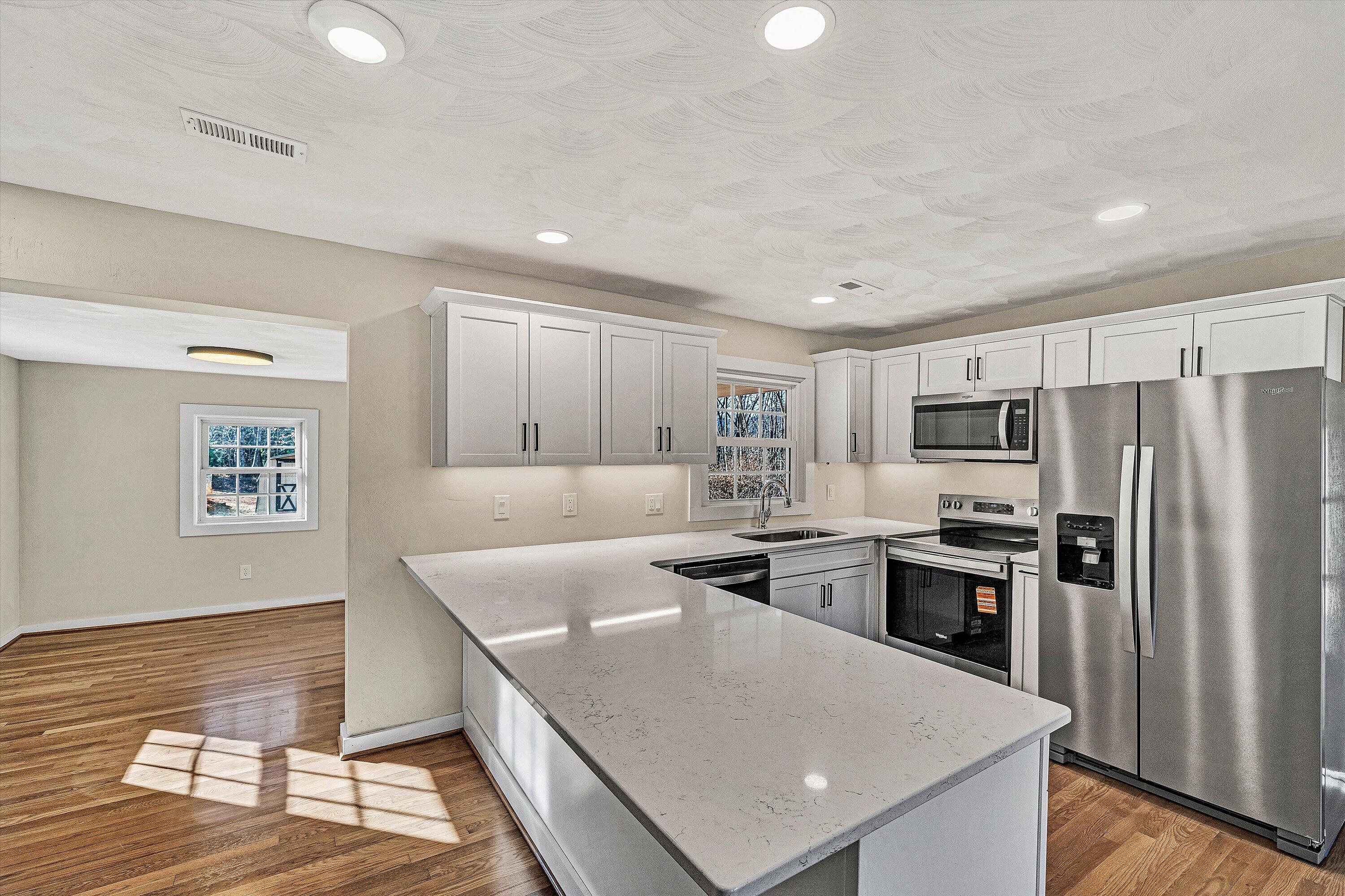 4883 Edwardsville Road Hardy, VA 24101 - Photo 9 of 32 a kitchen with cabinets and stainless steel appliances