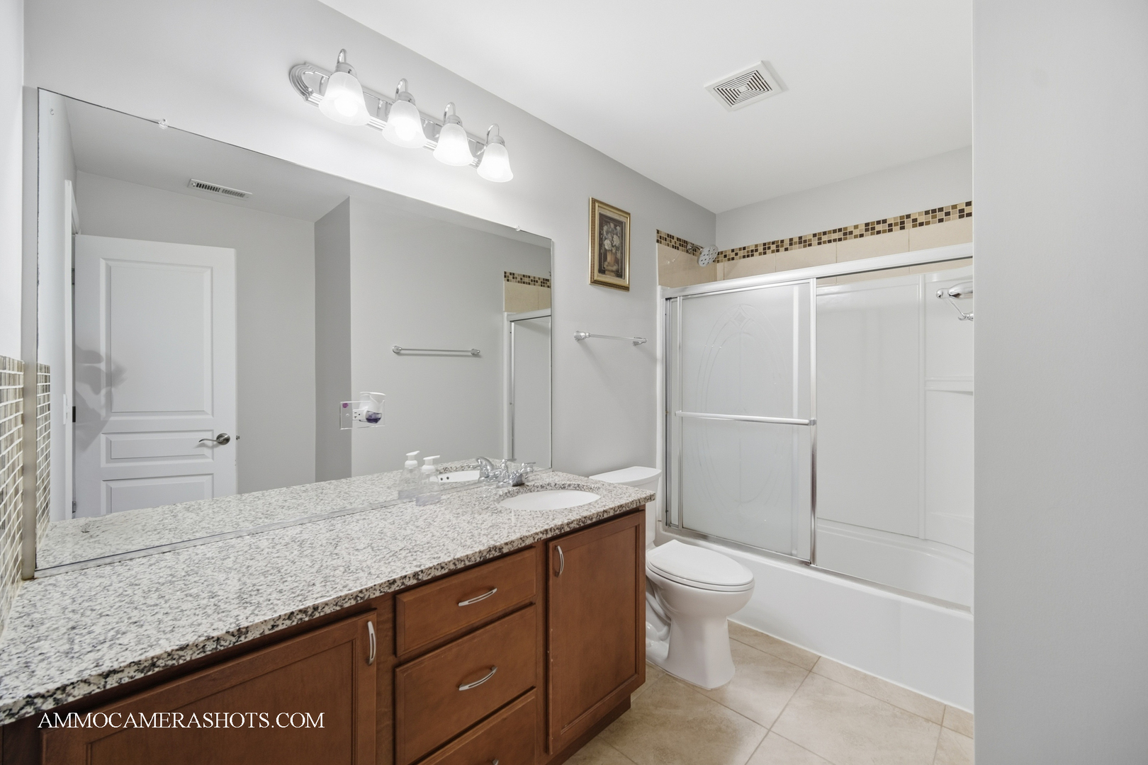 4308 Fraser Circle Naperville, IL 60564 - Photo 27 of 43 a bathroom with a granite countertop sink a toilet and shower