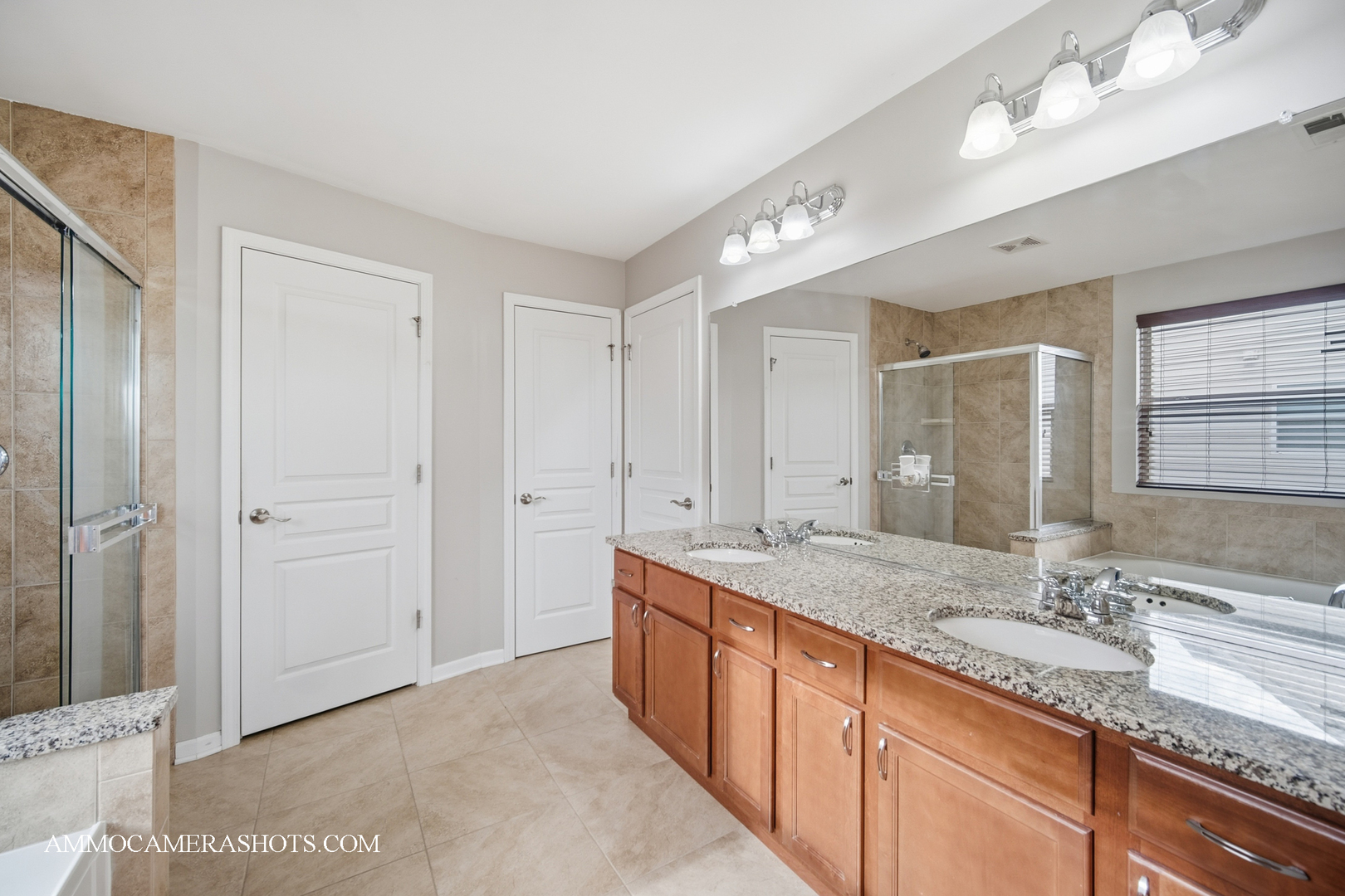4308 Fraser Circle Naperville, IL 60564 - Photo 28 of 43 a bathroom with a granite countertop double vanity sink and a mirror