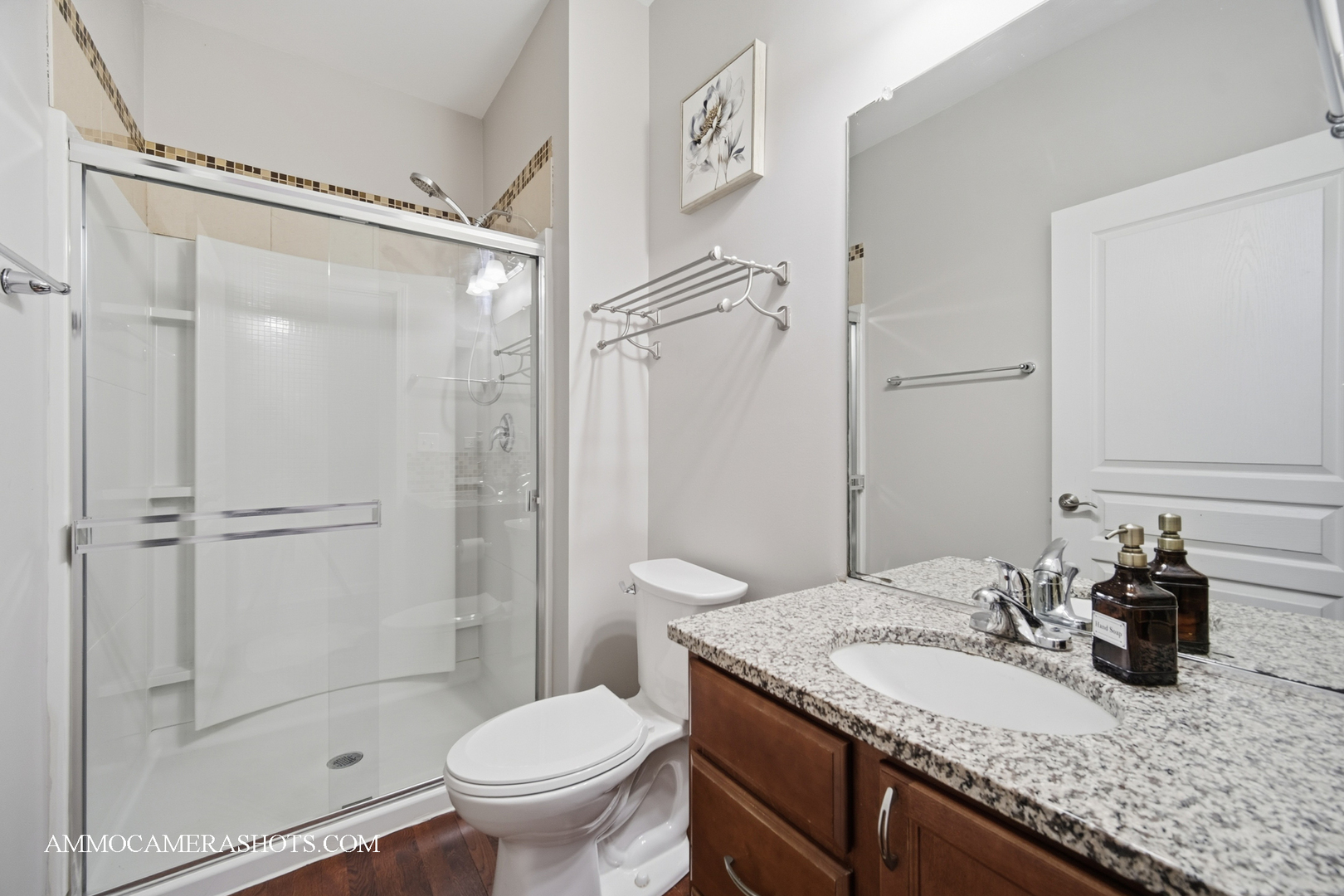 4308 Fraser Circle Naperville, IL 60564 - Photo 30 of 43 a bathroom with a granite countertop sink toilet and shower