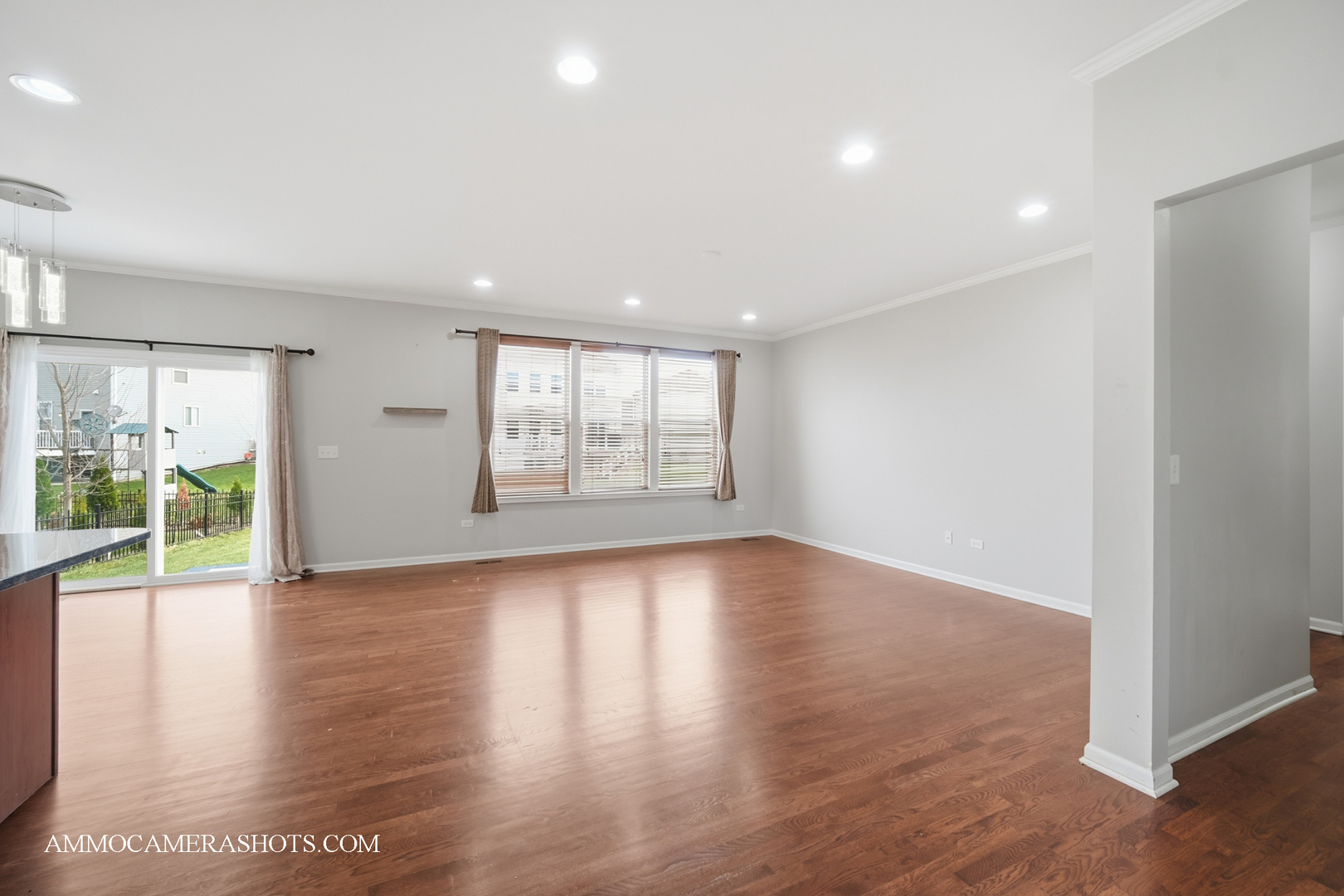 4308 Fraser Circle Naperville, IL 60564 - Photo 8 of 43 a view of an empty room with wooden floor and a window