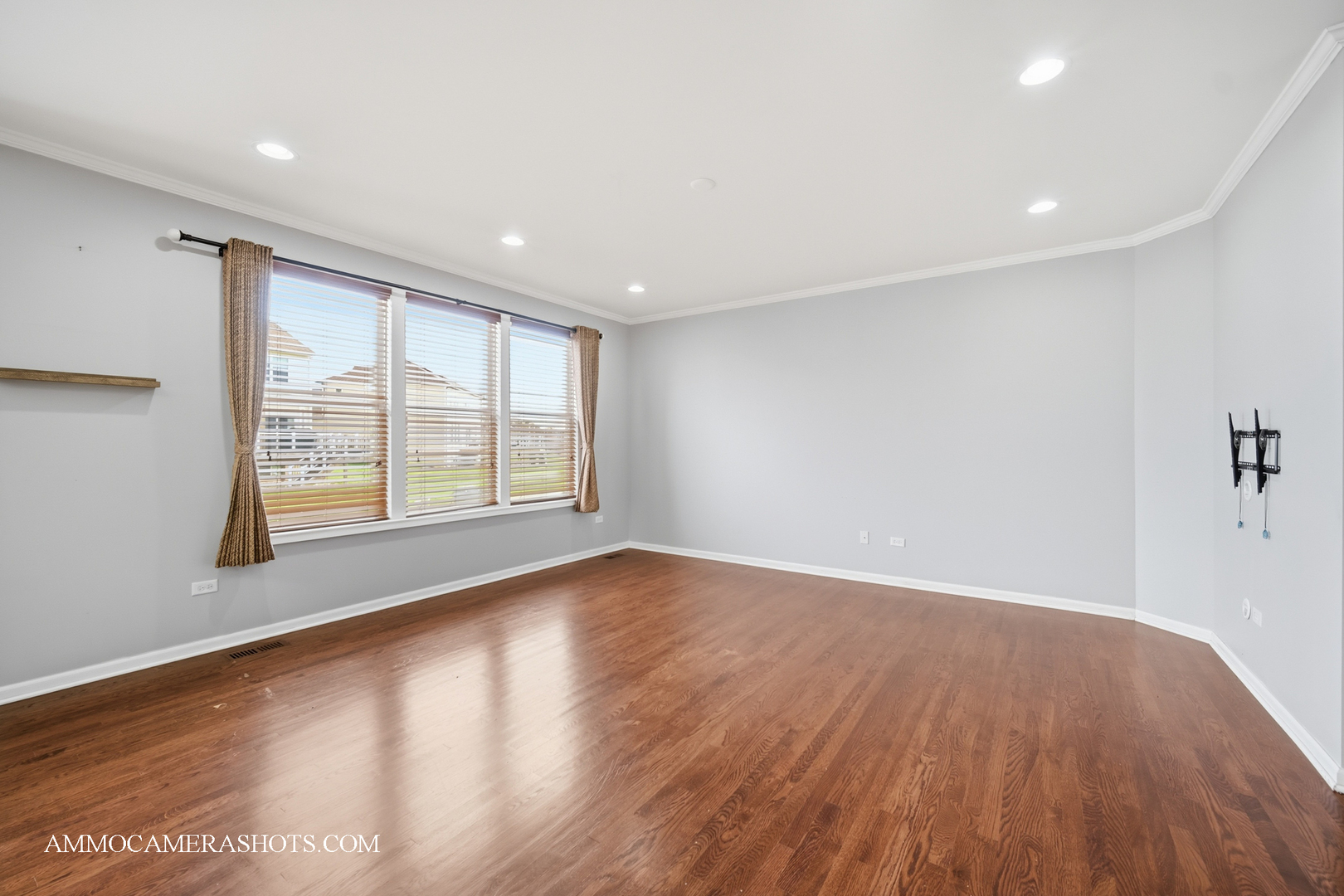 4308 Fraser Circle Naperville, IL 60564 - Photo 10 of 43 a view of an empty room with wooden floor and a window