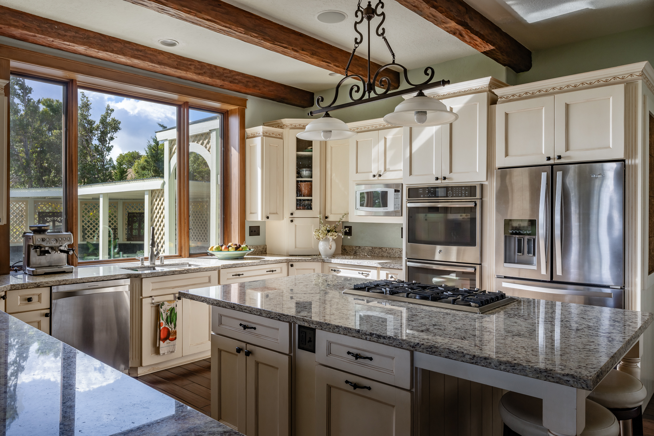 65-1508 Kawaihae Road Kamuela, HI 96743 - Photo 12 of 28 a kitchen with stainless steel appliances granite countertop a sink a stove and a refrigerator
