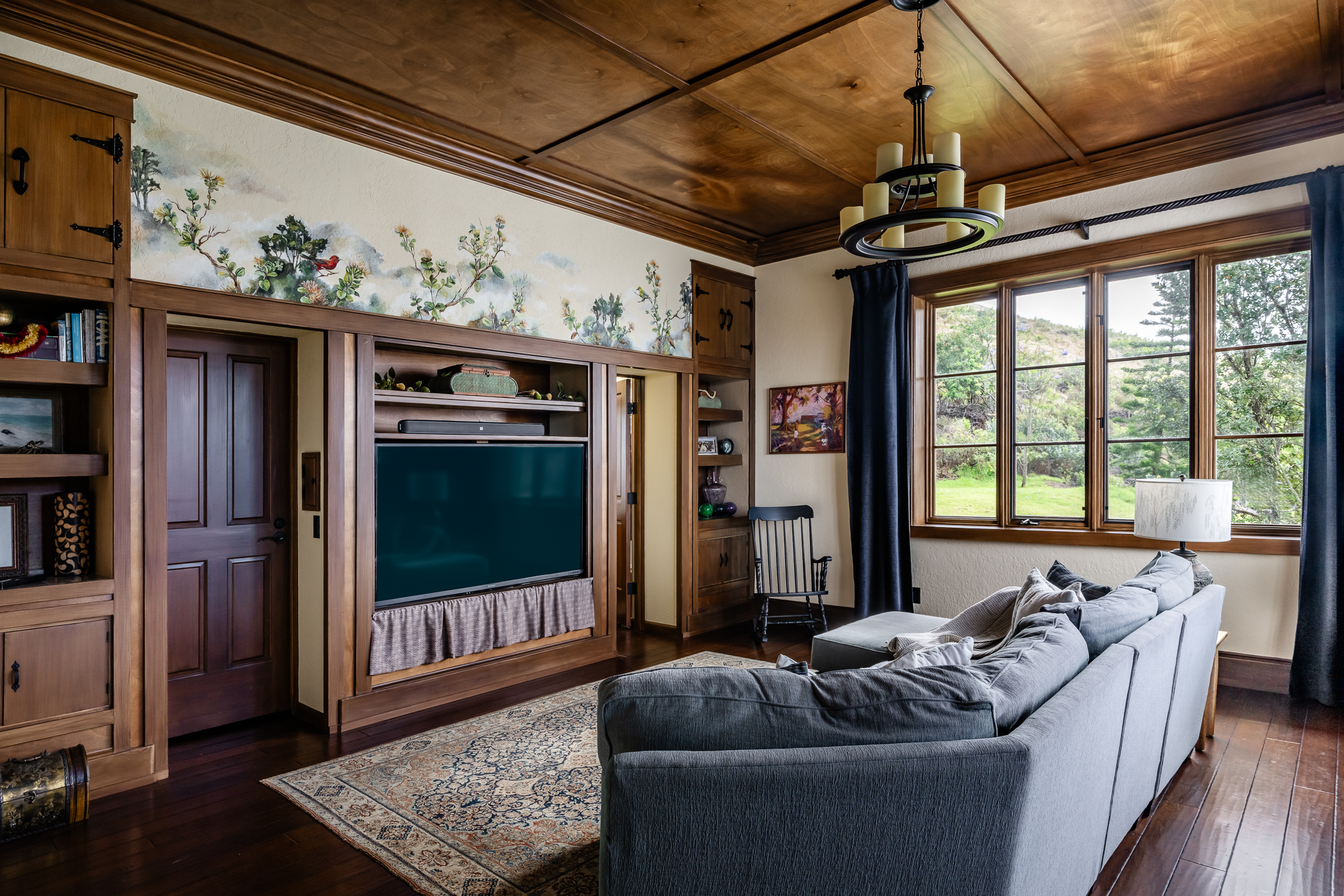 65-1508 Kawaihae Road Kamuela, HI 96743 - Photo 13 of 28 a living room with furniture a flat screen tv and a floor to ceiling window
