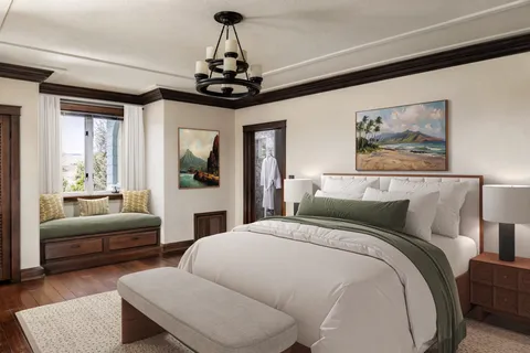 a bedroom with a large bed and a chandelier