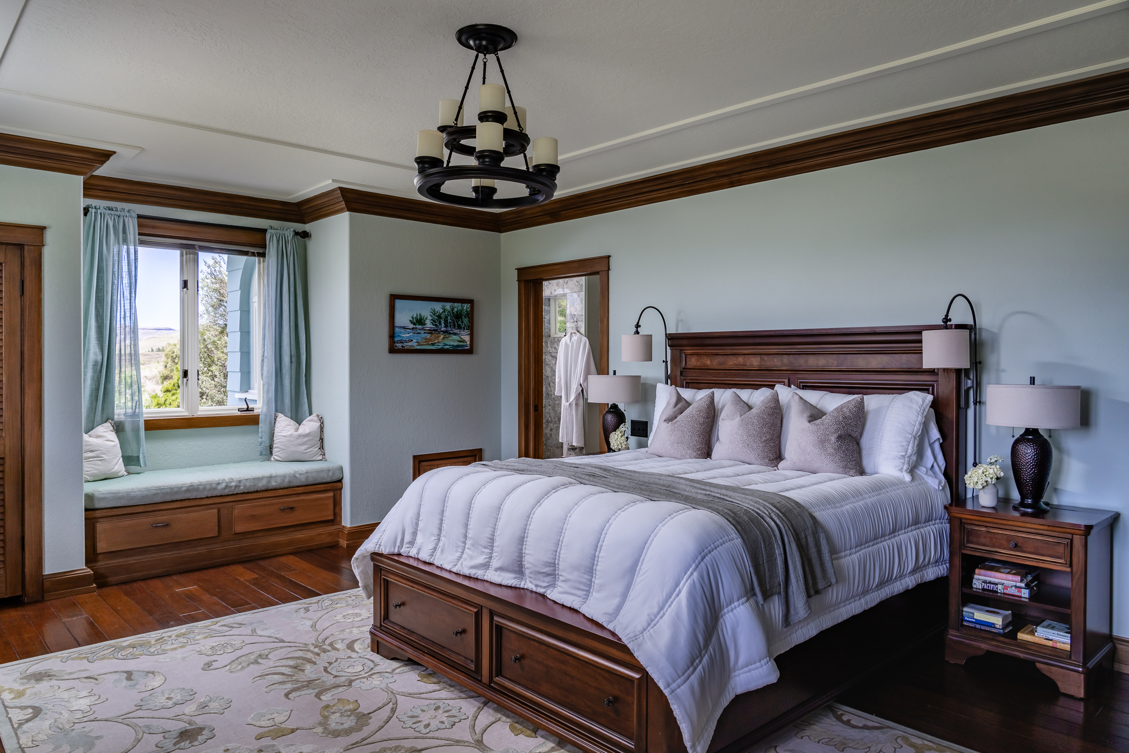 65-1508 Kawaihae Road Kamuela, HI 96743 - Photo 15 of 28 a bedroom with a bed and a chandelier