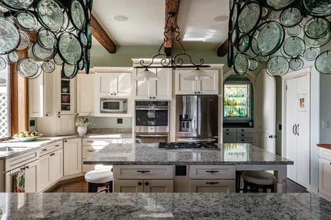a kitchen with sink and cabinets
