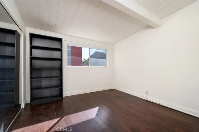 an empty room with wooden floor