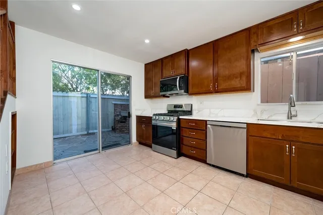 a view of a kitchen with electric appliances