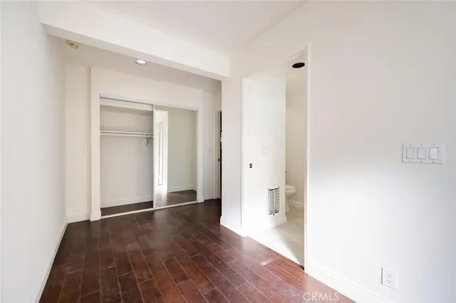 a bathroom with a white bath tub sitting next to a white sink and a shower