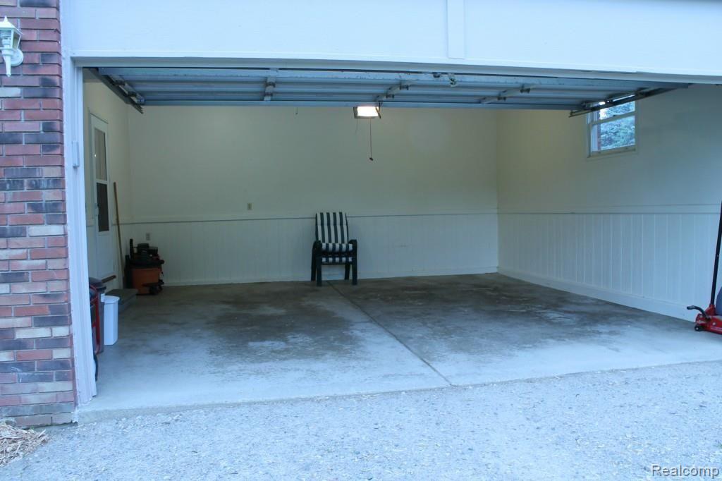 6544 General Squier Road Almont, MI 48003 - Photo 40 of 53 Attached two car garage with door opener. Garage also has side entry door.