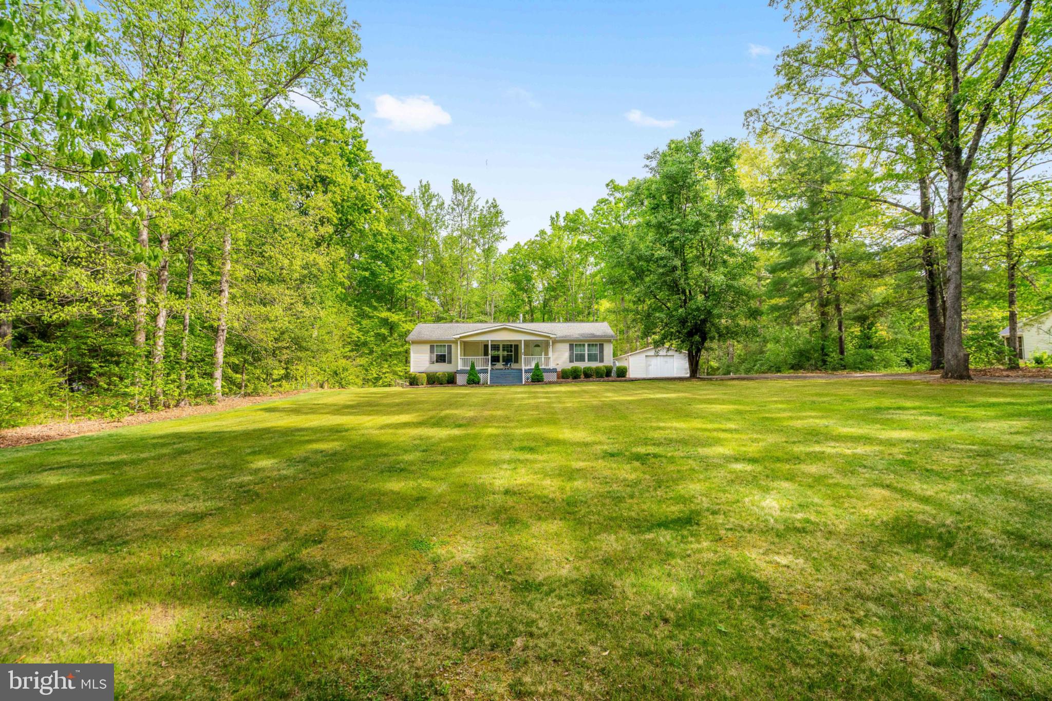 2319 Sizer Road Beaverdam, VA 23015 - Photo 9 of 61 a front view of a house with a big yard