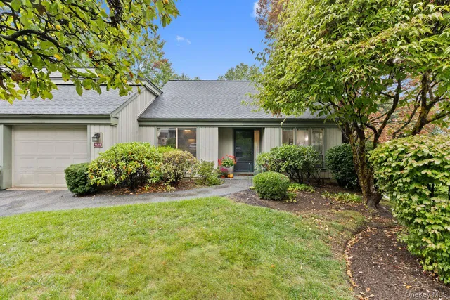 a house that is sitting in the grass