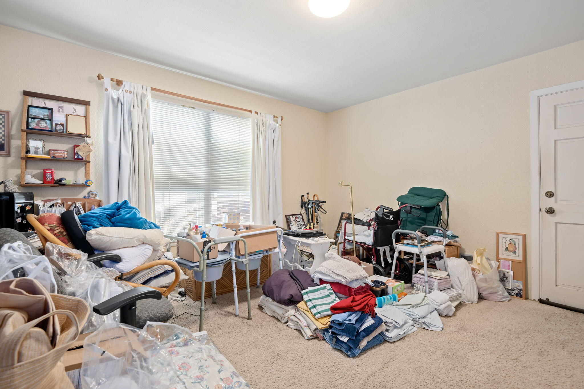 1712 Lasuen Road Santa Barbara, CA 93103 - Photo 13 of 36 a living room with lots of furniture and a gym equipment