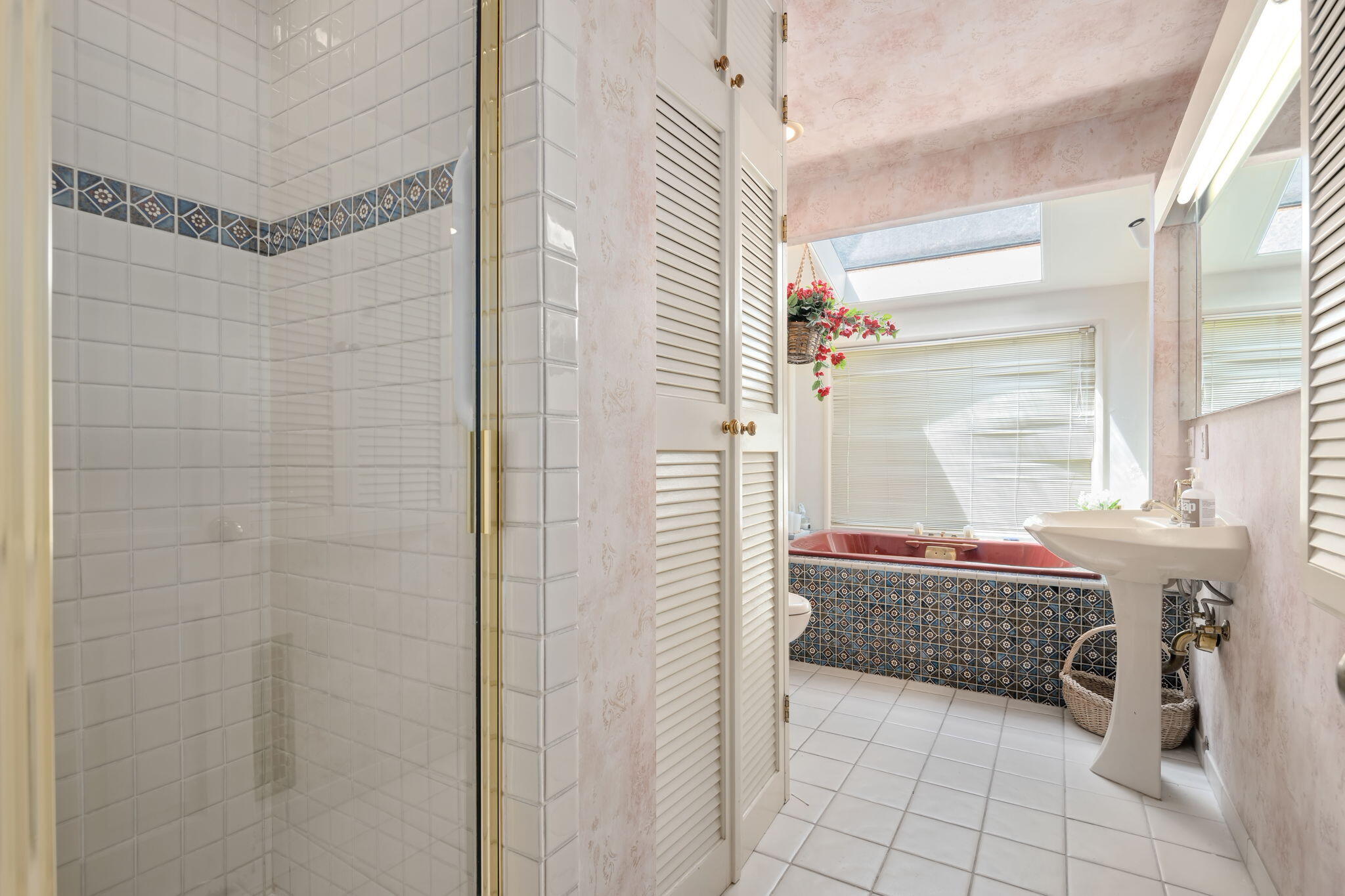 1712 Lasuen Road Santa Barbara, CA 93103 - Photo 14 of 36 a bathroom with a bathtub and shower