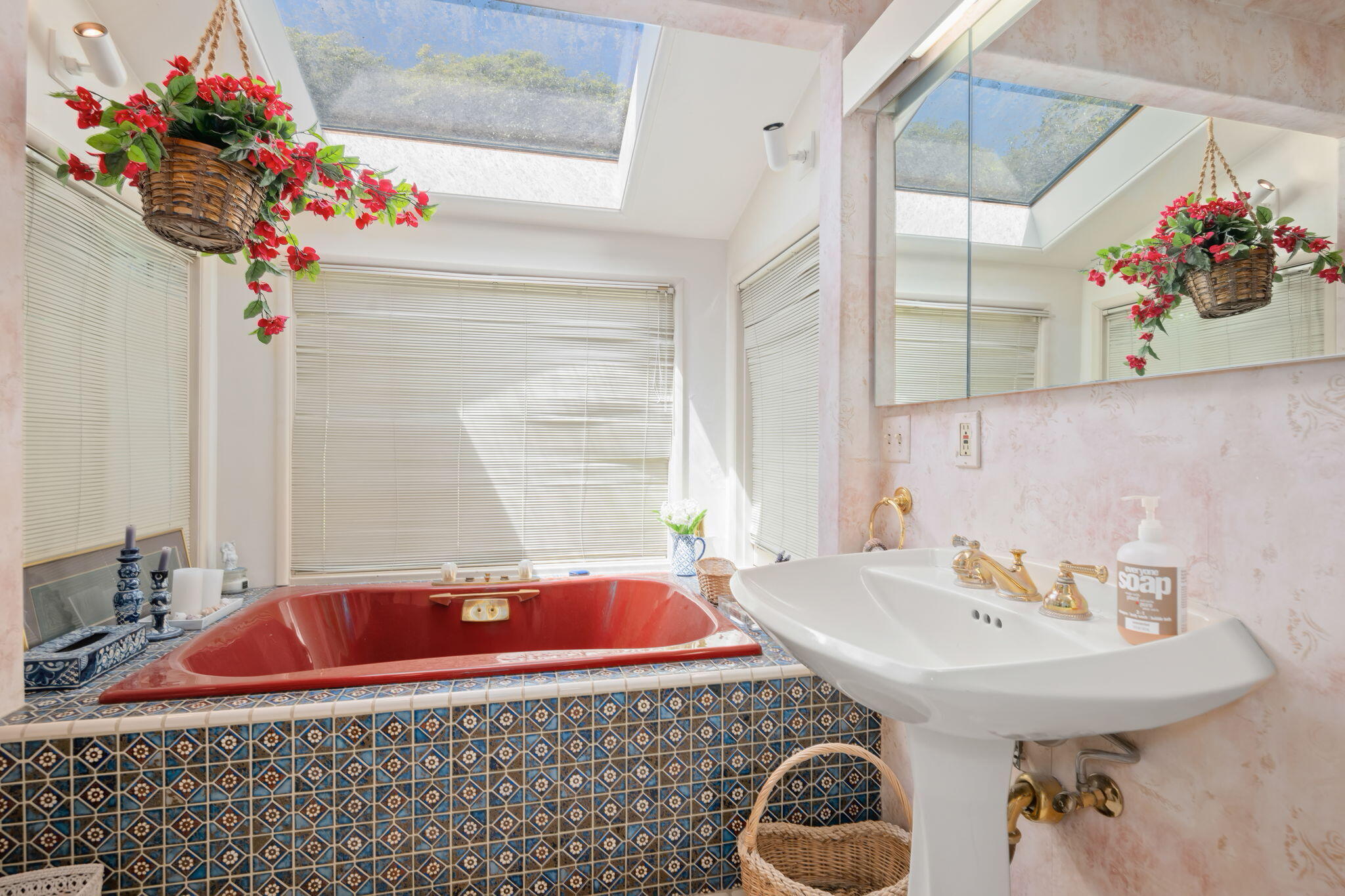 1712 Lasuen Road Santa Barbara, CA 93103 - Photo 15 of 36 a bathroom with a sink and a mirror