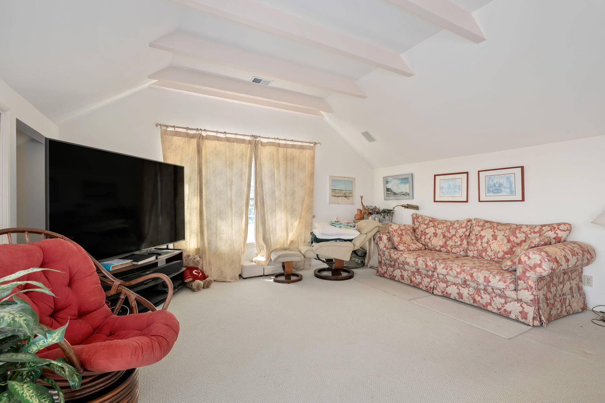 1712 Lasuen Road Santa Barbara, CA 93103 - Photo 17 of 36 a living room with furniture gym equipment and a flat screen tv