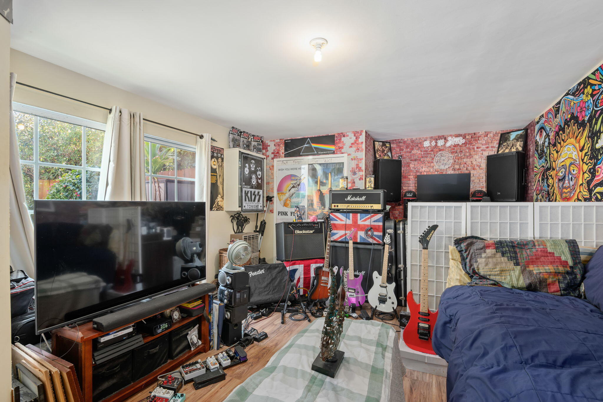 1712 Lasuen Road Santa Barbara, CA 93103 - Photo 23 of 36 a living room with lots of furniture and a flat screen tv