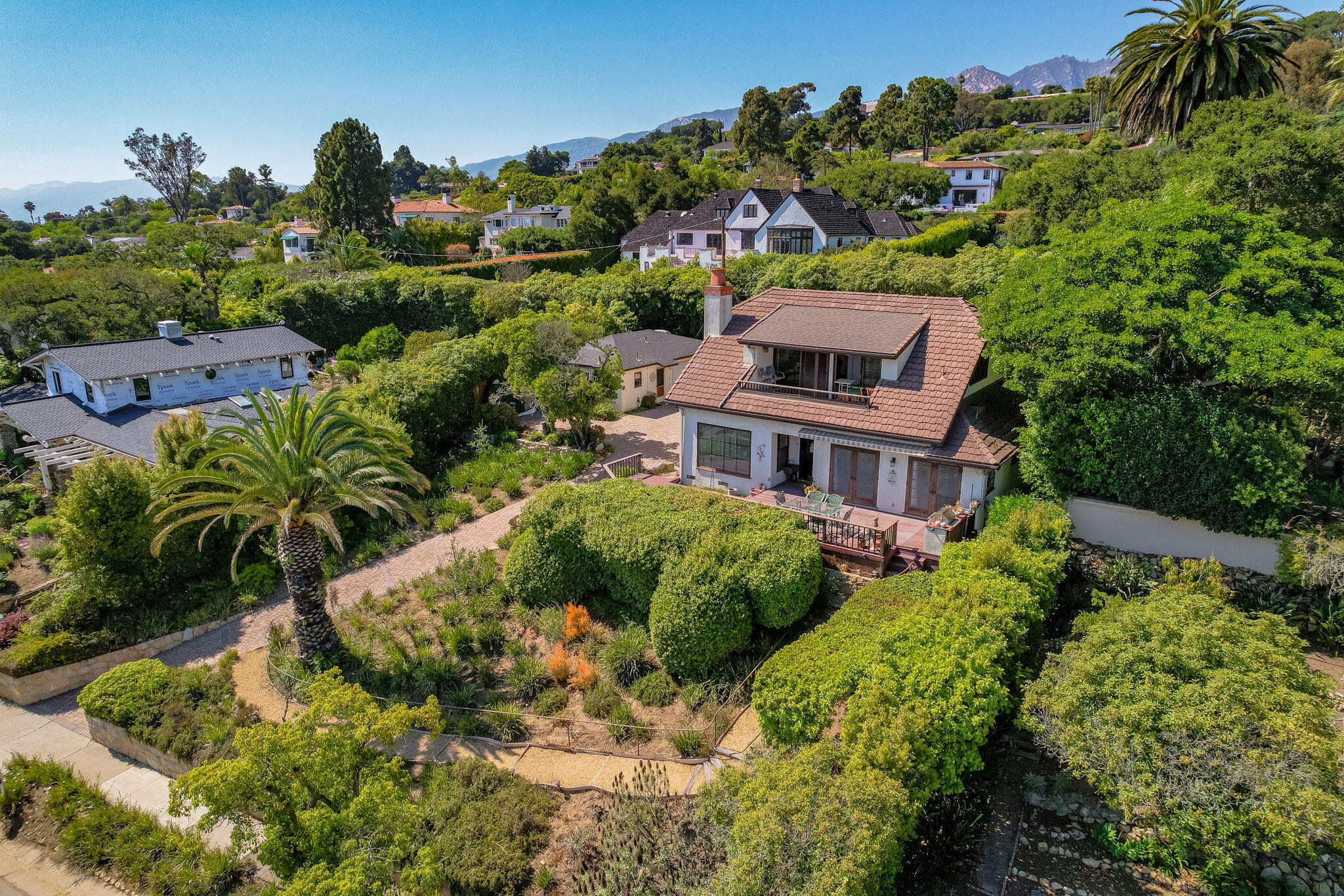 1712 Lasuen Road Santa Barbara, CA 93103 - Photo 30 of 36 a aerial view of a house with a yard and potted plants