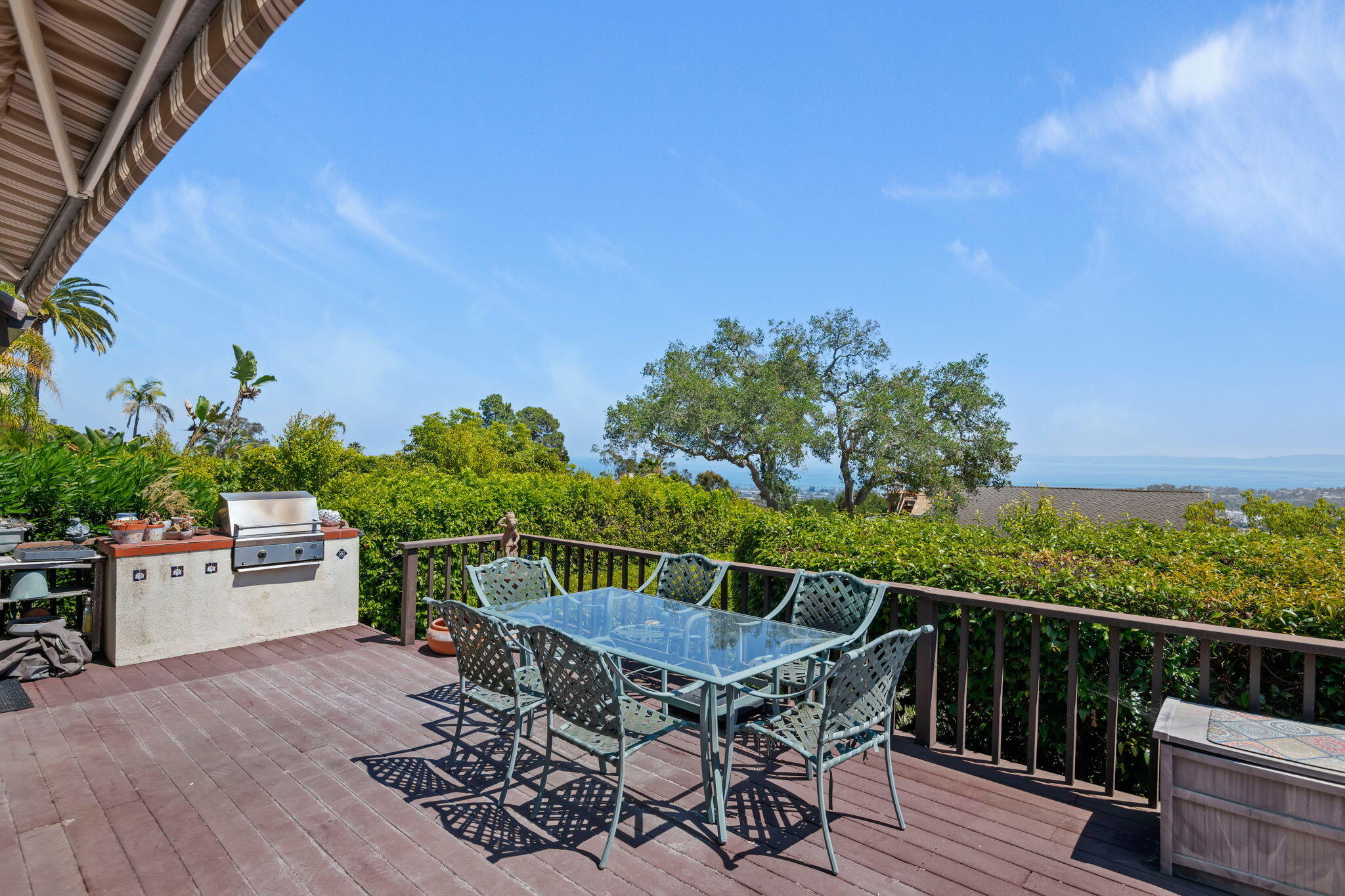 1712 Lasuen Road Santa Barbara, CA 93103 - Photo 4 of 36 a terrace with outdoor seating and wooden floor