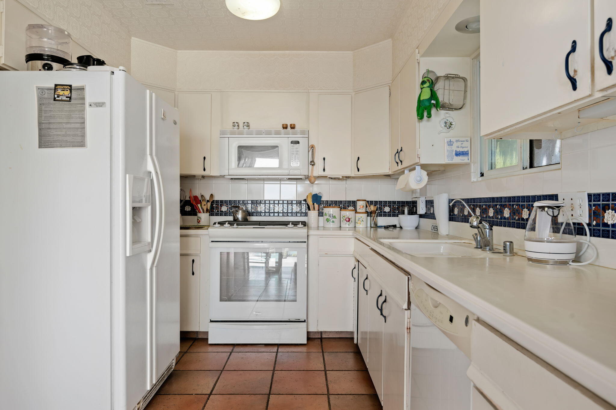 1712 Lasuen Road Santa Barbara, CA 93103 - Photo 9 of 36 a kitchen with stainless steel appliances granite countertop a refrigerator and a stove