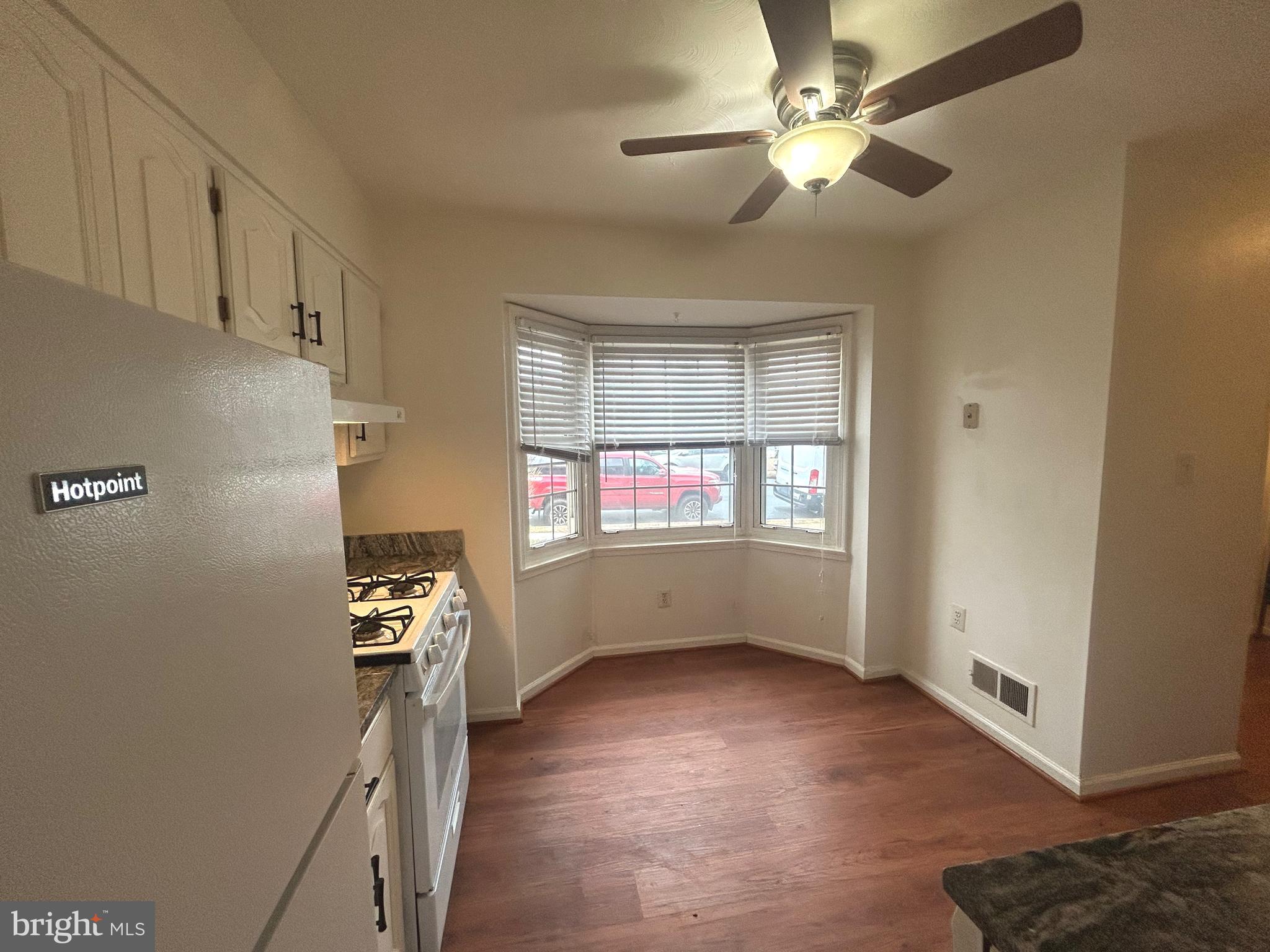 10177 Irongate Way Manassas, VA 20109 - Photo 5 of 25 a view of livingroom with hardwood floor and a ceiling fan