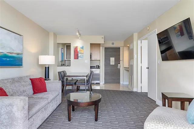 a bedroom with a bed couch and a window