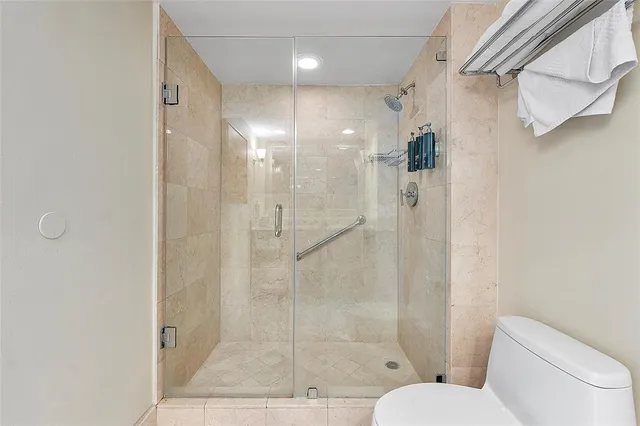 a view of a balcony with a chair and a fireplace