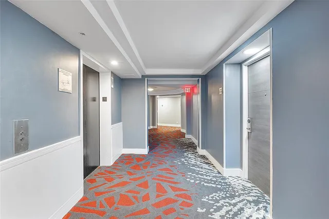 a living room with lots of furniture and kitchen view