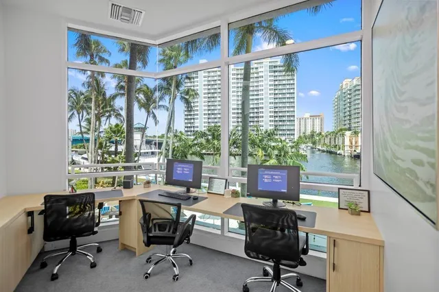 a view of a patio with couches and a table and chairs with wooden floor