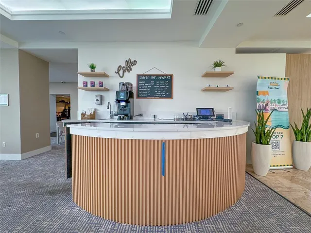 a living room with furniture gym equipment and a flat screen tv
